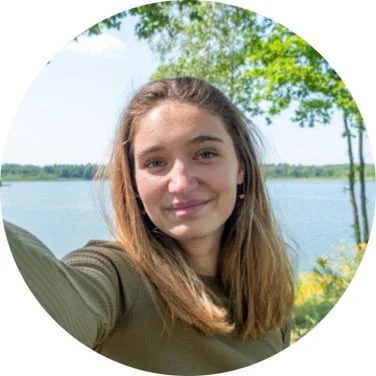 Tesla Wealth Script customer review profile picture featuring a smiling young woman outdoors, representing a satisfied user who successfully used the audio program to improve her daily motivation and perspective.