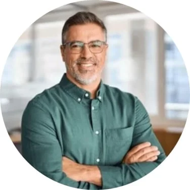 Tesla Wealth Script customer review profile picture featuring a smiling man in a green shirt who successfully used the audio program to improve his daily focus.